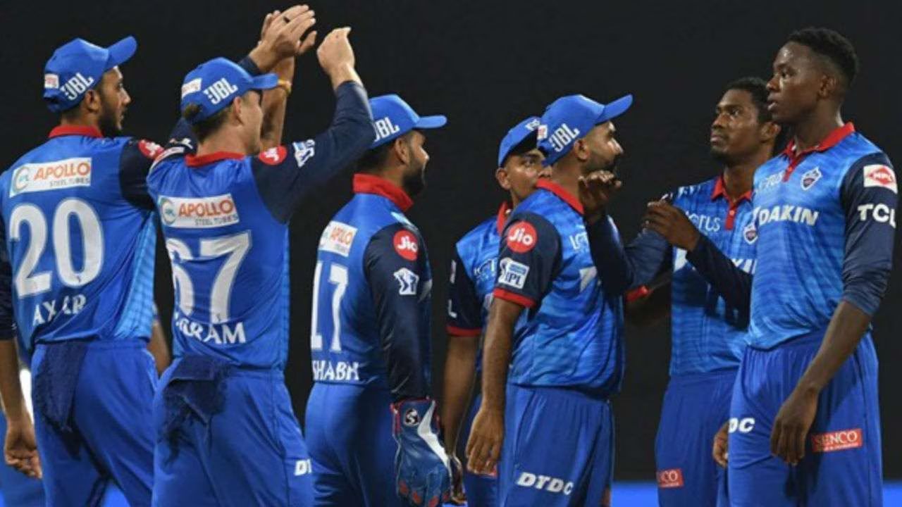 delhi capitals in ground in team jersey and celebrating