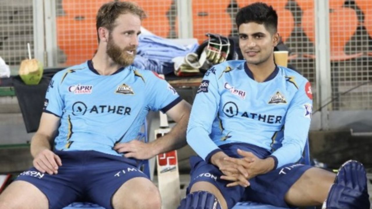 kane williamson and shubman gill sitting on chair wearing gujrat titans jersey