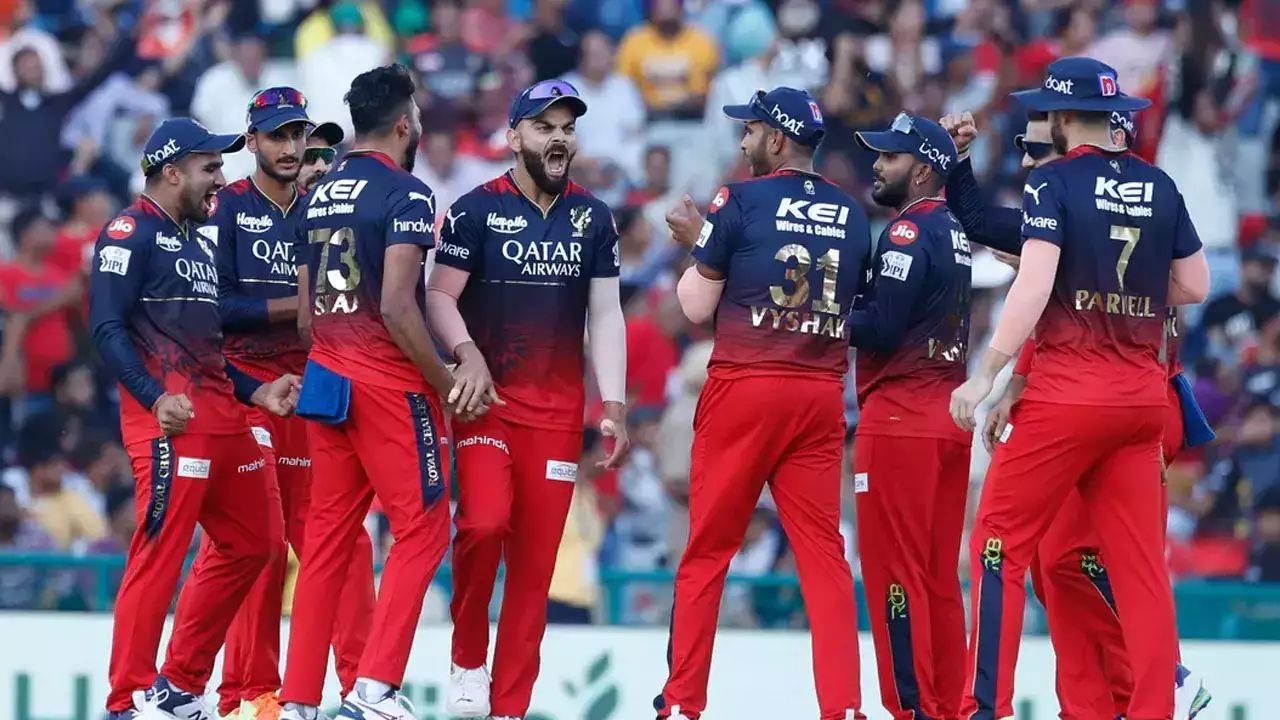 rcb team players in ground celebrating